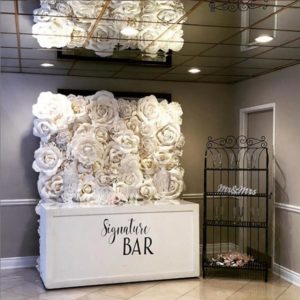 Portable Bar with White Flower Wall